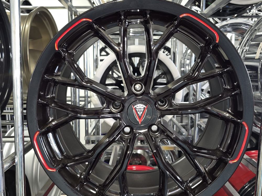 Venom gloss black wheel with red accents — new custom rims available at Llantera Del Norte, Aurora CO